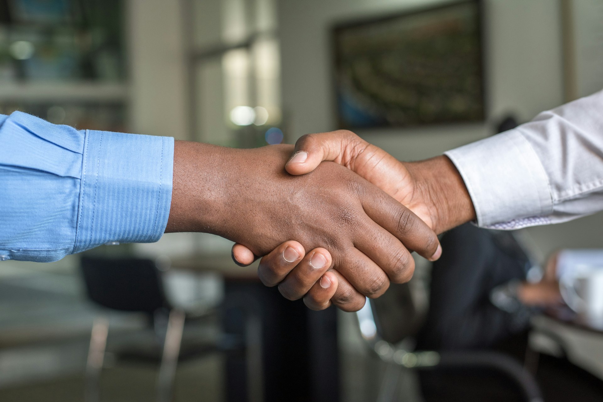 Business handshake sealing an agreement in a modern office