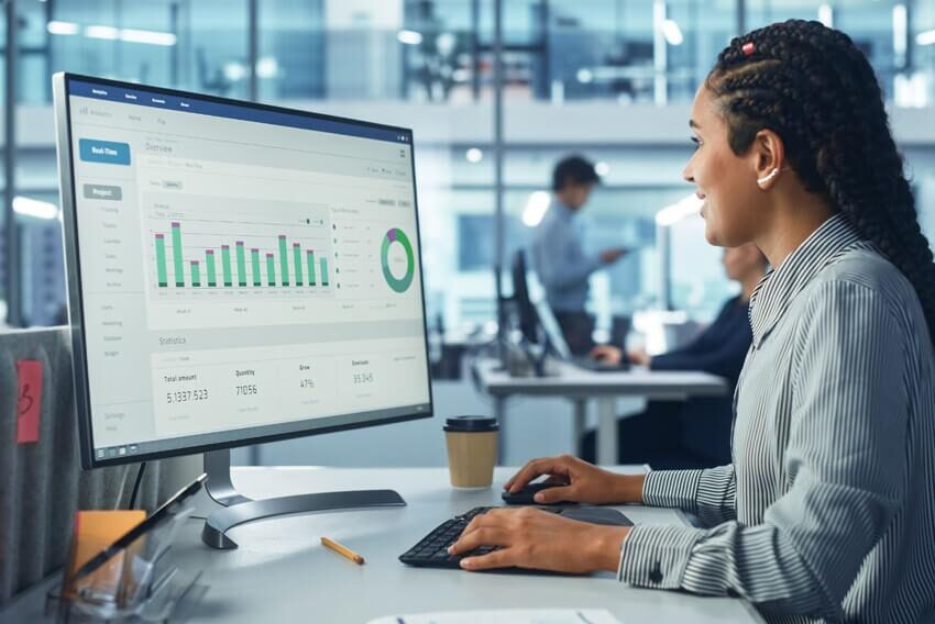 IFC analyst reviewing a risk and performance dashboard
